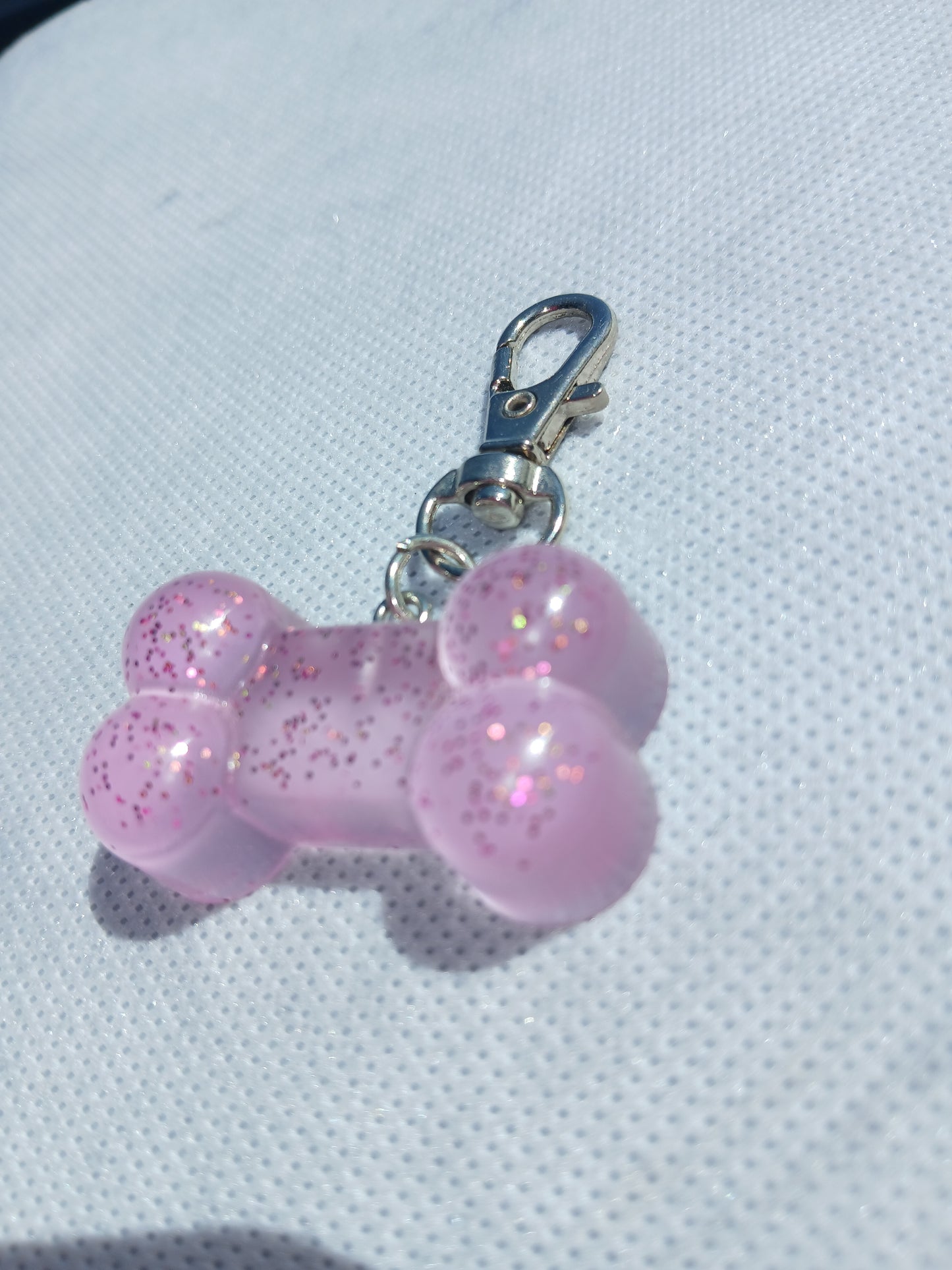 Purple glitter bone keychain